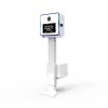 Capture Your Spin The 15.6” LG Touch Screen Selfie Mirror Photo Booth, featuring advanced touch screen technology, invites guests with the message: "Touch the screen to start." It is stylishly positioned on a tall, adjustable stand.